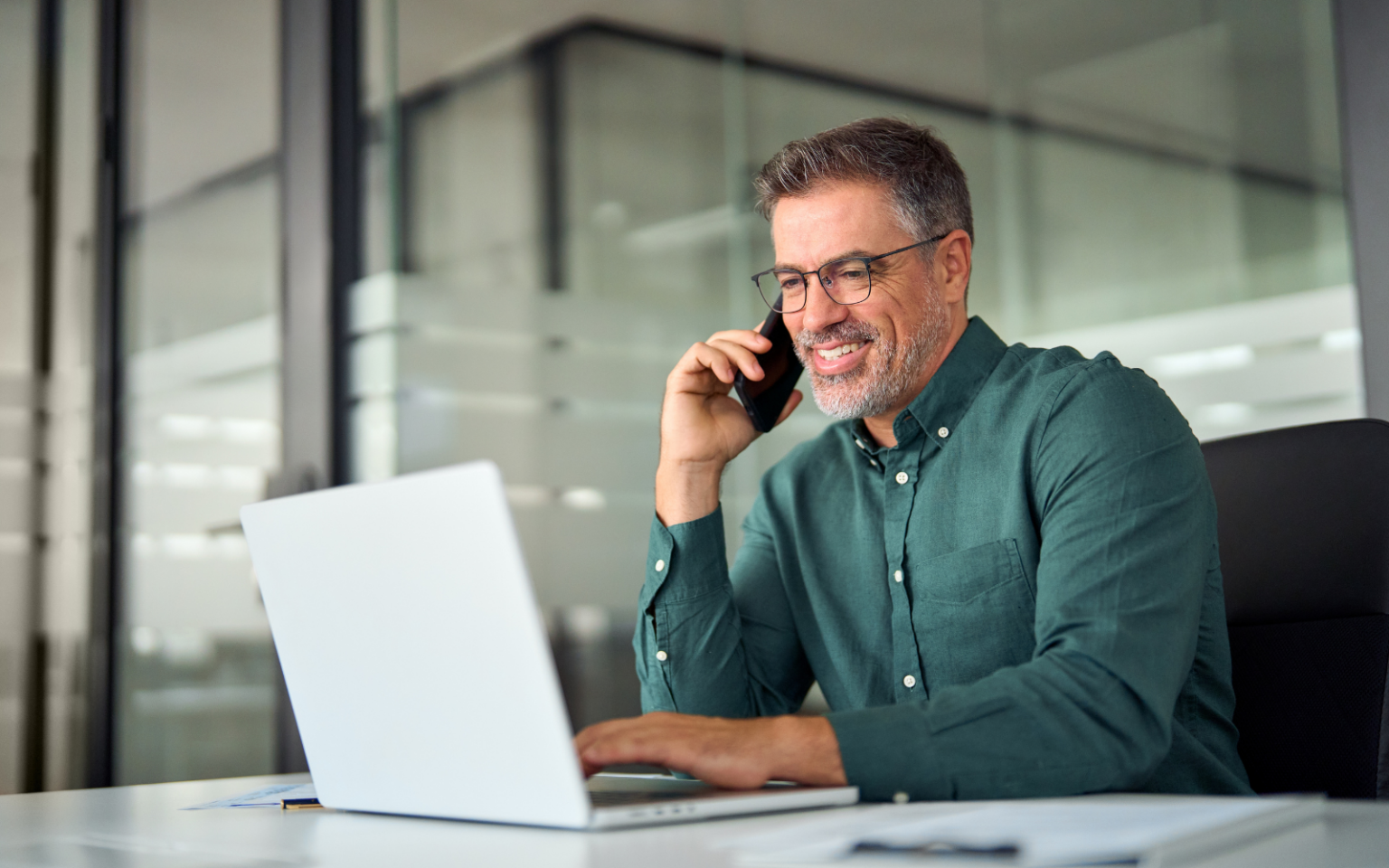 Man on the phone, happy to find the right recruiter