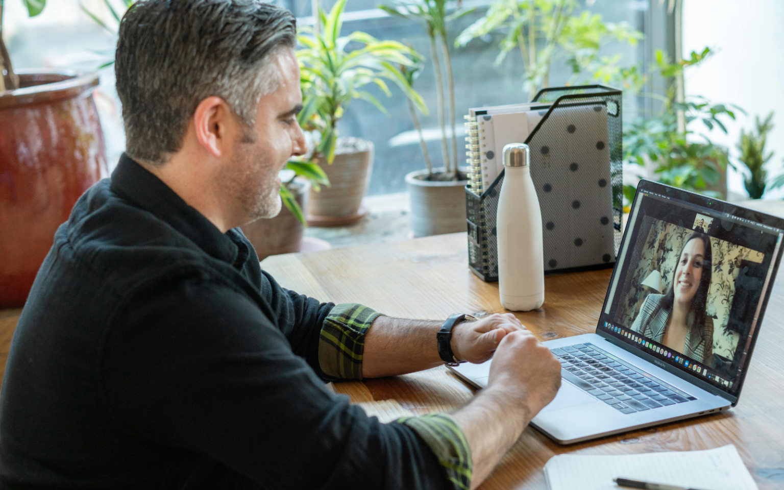 Man on a video call with a contractor having learned about the best ways for how to interview a contractor